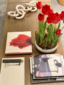 red tulips on brown coffee table